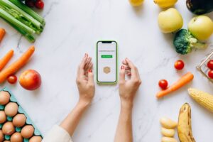 iFood Benefícios compra a Caju: como isso afeta o mercado de vale-refeição no Brasil